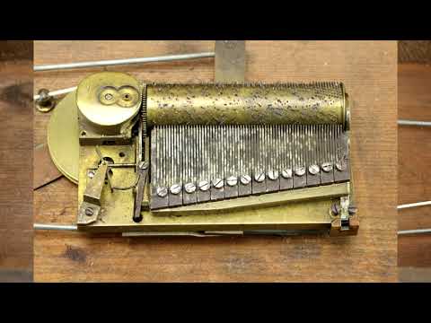 Early sectional comb Inlaid musical clock base, 2 Tunes